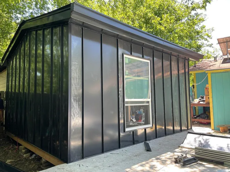 Black standing seam metal wall panels for Roof Inspection in Eureka